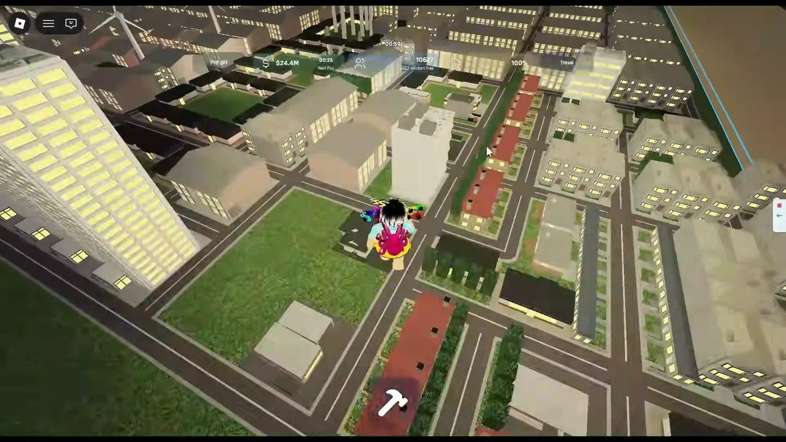 Build and Conquer Roblox top-down view of road grid and low buildings with a player avatar above an intersection and a vertical blue boundary line on the right beside tan undeveloped ground.